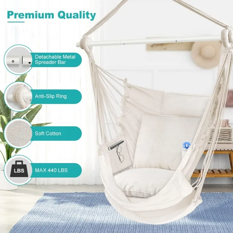 Elegantly styled hammock chair with cushions creating a cozy reading nook on a covered porch
