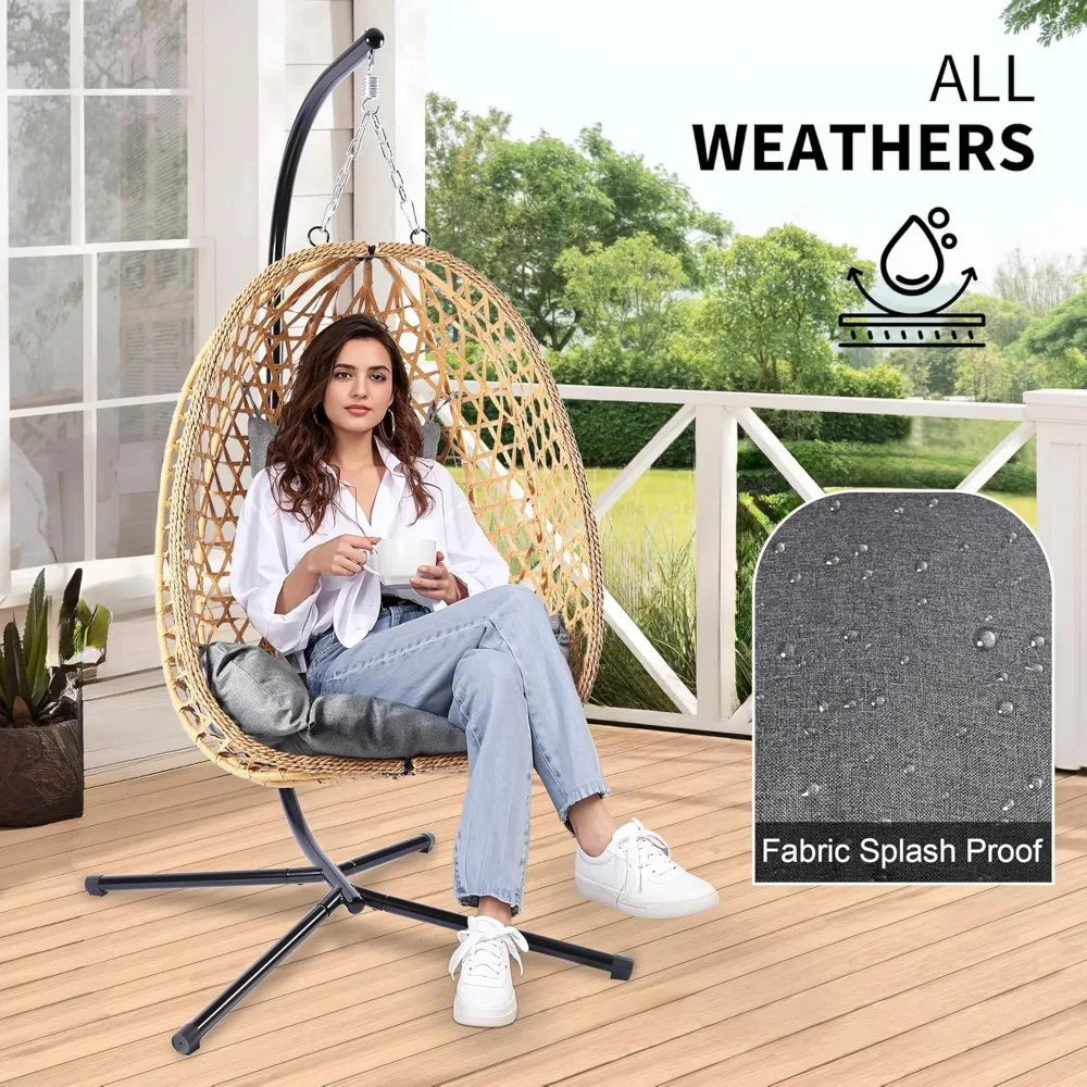Stylish dark wicker hanging egg chair with plush cushion for ultimate comfort